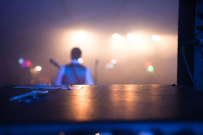 Rear view of musician playing at stage