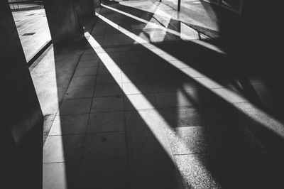 High angle view of shadow on footpath