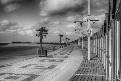 Empty pier on sea against sky