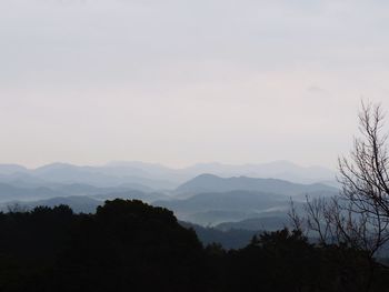 Scenic view of silhouette mountains against sky