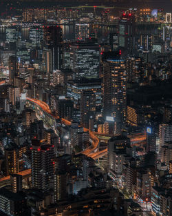 High angle view of illuminated city buildings at night