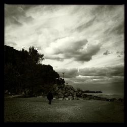 Scenic view of sea against cloudy sky