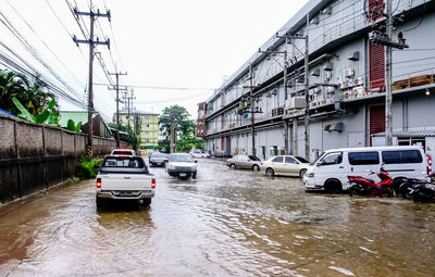 Cars on wet street during rainy season