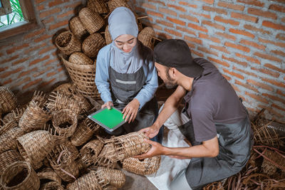 High angle view of man working on hay