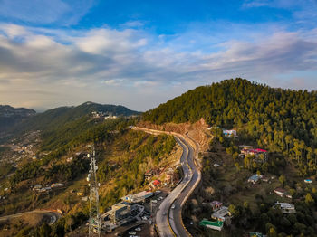 High angle view of road amidst plants against sky