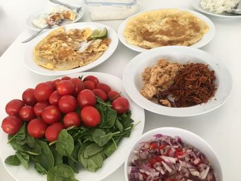 High angle view of chopped fruits in bowl on table