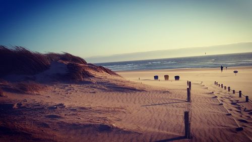 Scenic view of beach against clear sky