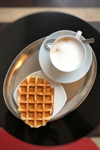 High angle view of coffee cup on table