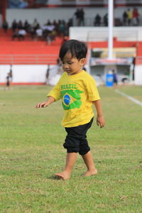 Little boy playing on the ball field