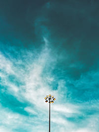 Low angle view of illuminated street light against sky