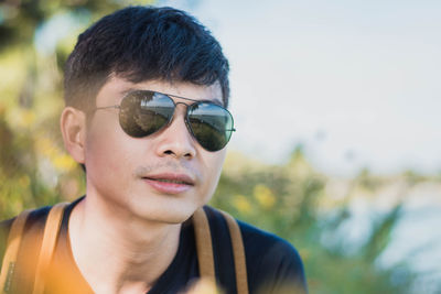 Portrait of young man wearing sunglasses