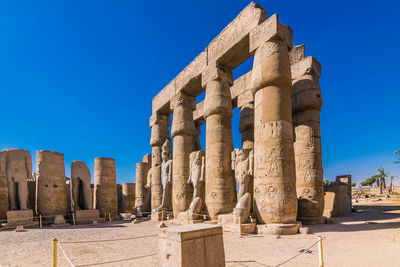 Ruins of temple of karnak in luxor, egypt. blue sky no clouds and no people