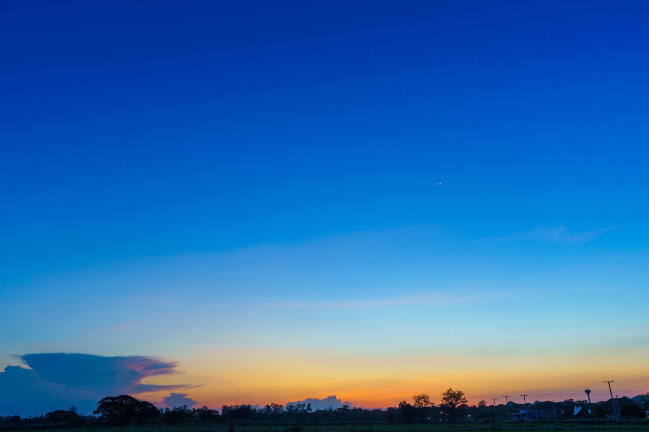 SILHOUETTE CITY AGAINST BLUE SKY
