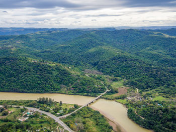 High angle view of road by river against sky