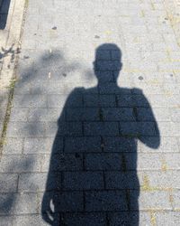 Shadow of people on street