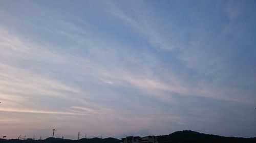 Low angle view of silhouette mountain against sky