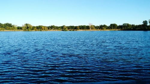 View of calm lake against clear sky