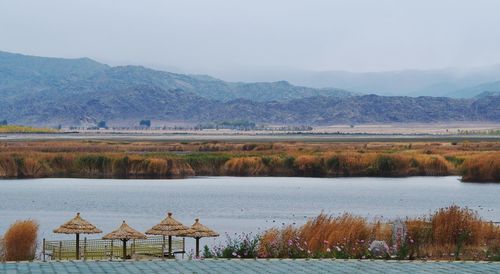 View of lake with mountain range in background