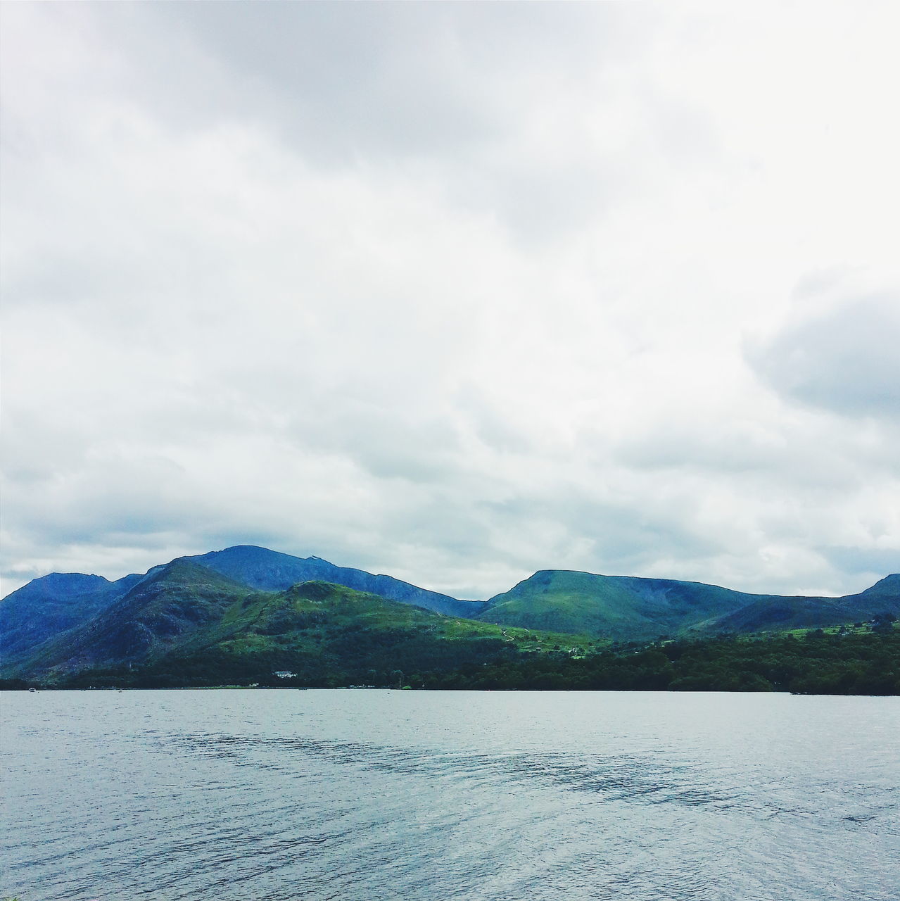 tranquil scene, mountain, tranquility, scenics, nature, sky, beauty in nature, no people, water, idyllic, mountain range, outdoors, cloud - sky, landscape, day