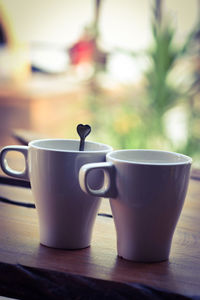 Close-up of coffee cup on table