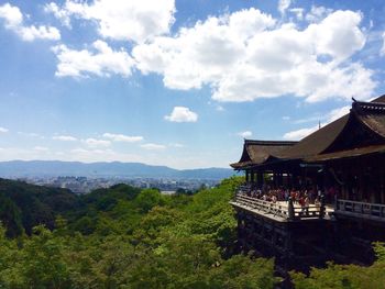 Kiyomizu-dera by trees against sky
