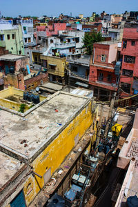 High angle view of construction site by buildings in city