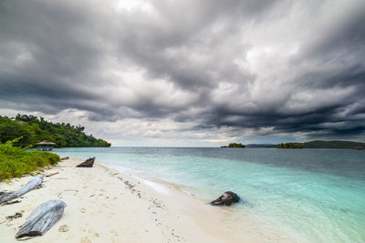 Scenic view of sea against cloudy sky