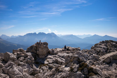 Scenic view of rocks and mountains against sky