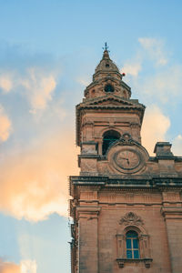 Low angle view of clock tower against sky