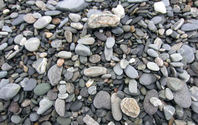 High angle view of stones on pebbles