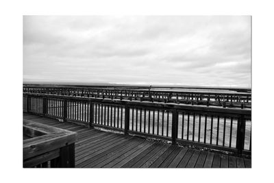 View of bridge against cloudy sky