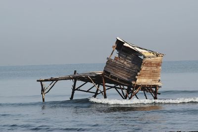 Lifeguard hut on sea against clear sky