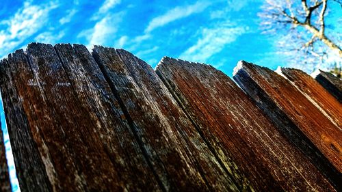 Low angle view of field against blue sky