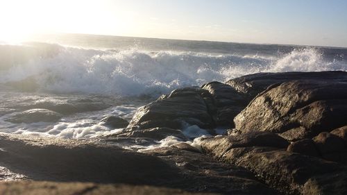 Scenic view of sea against sky on sunny day