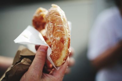 Close-up of hand holding ice cream