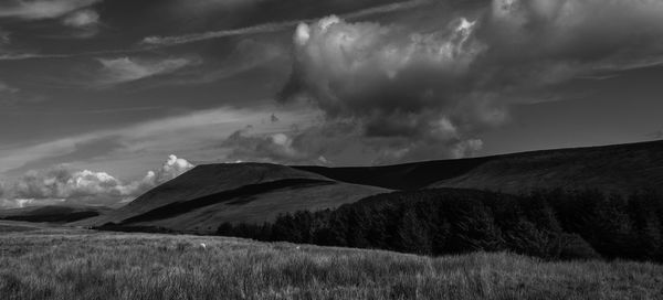 View of landscape against cloudy sky