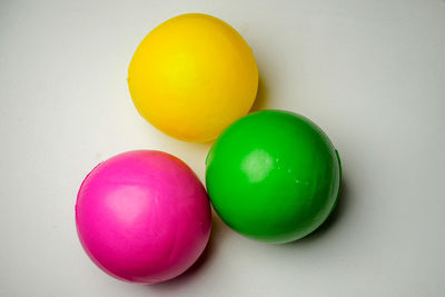 Directly above shot of multi colored eggs on white background