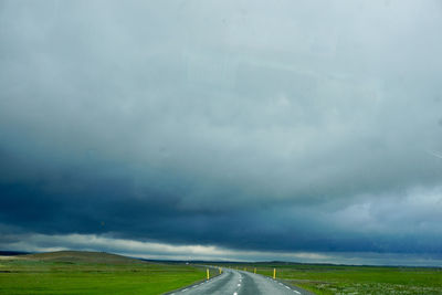 Road amidst landscape against sky