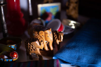 Close-up of elephant figurines on table at home