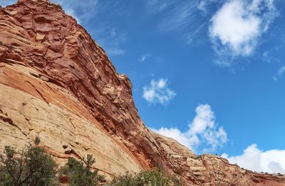 Low angle view of rock formation against sky