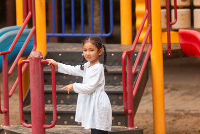 Portrait of girl playing at playground