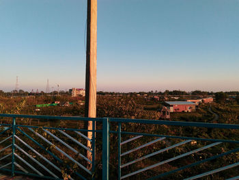 Aerial view of buildings against clear sky