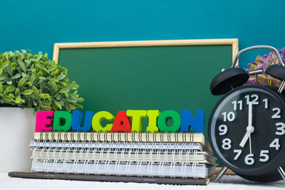 Close-up of clock on table