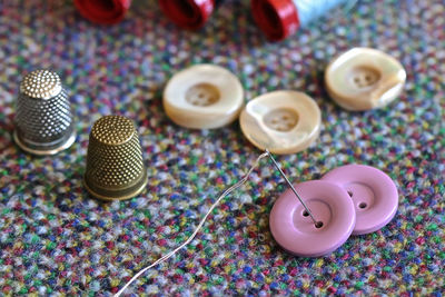 High angle view of various buttons on table