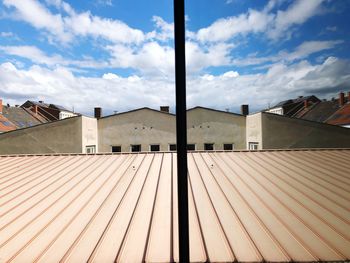 Low angle view of roof and building against sky