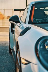 Close-up of car parked in parking lot