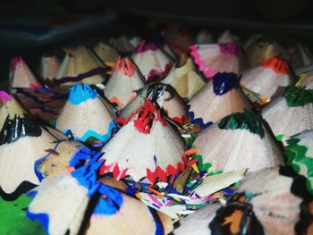 Close-up of colorful pencil shavings on table