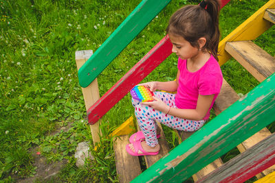 Side view of boy playing in park