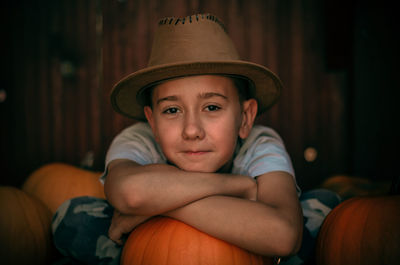 Portrait of cute boy holding pumpkin