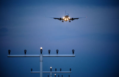 Low angle view of airplane flying in sky